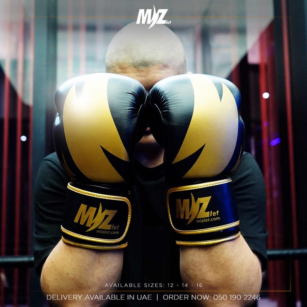 Mizlet Gold Elite black and gold boxing gloves — front view